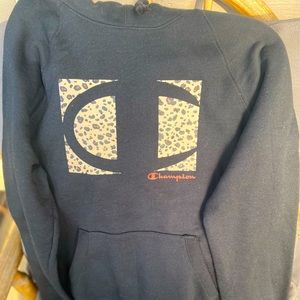 Champion Hoodie |Color is Black with cheetah print patterns in it |Size Small